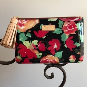 Dooney & Bourke Floral clutch with Leather Tassel.